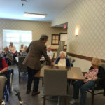 residents of a senior living community engaged in an activity