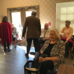 residents of a senior living community enjoying a group activity